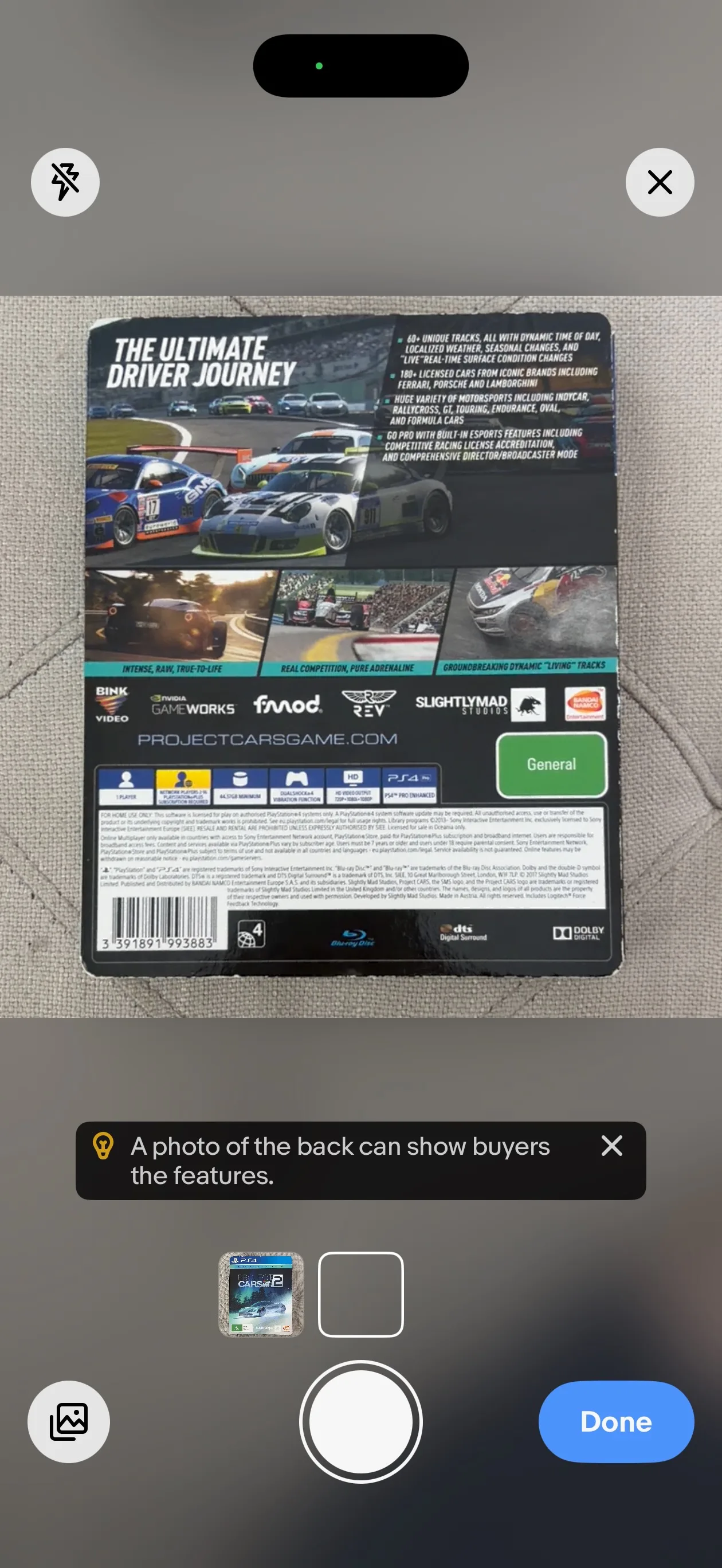 The eBay camera prompting for a second photo of the back of the case, with a tip reading 'A photo of the back can show buyers the features.'